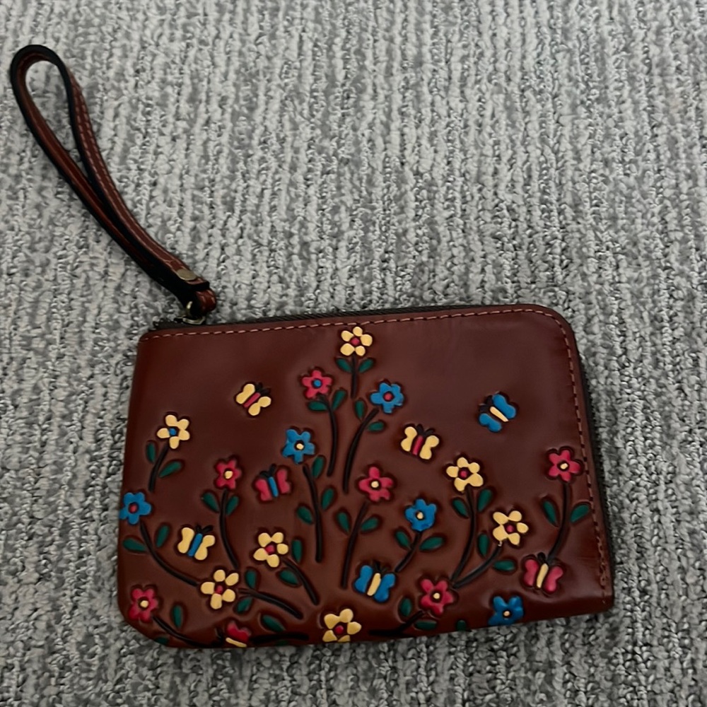 Brown decorated wristlet from Patricia Nash